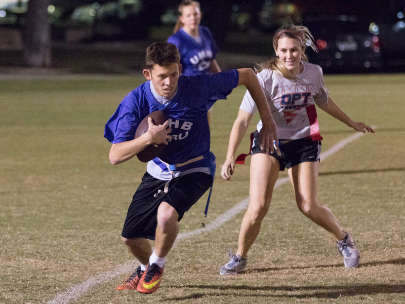 Students playing intramural flag football